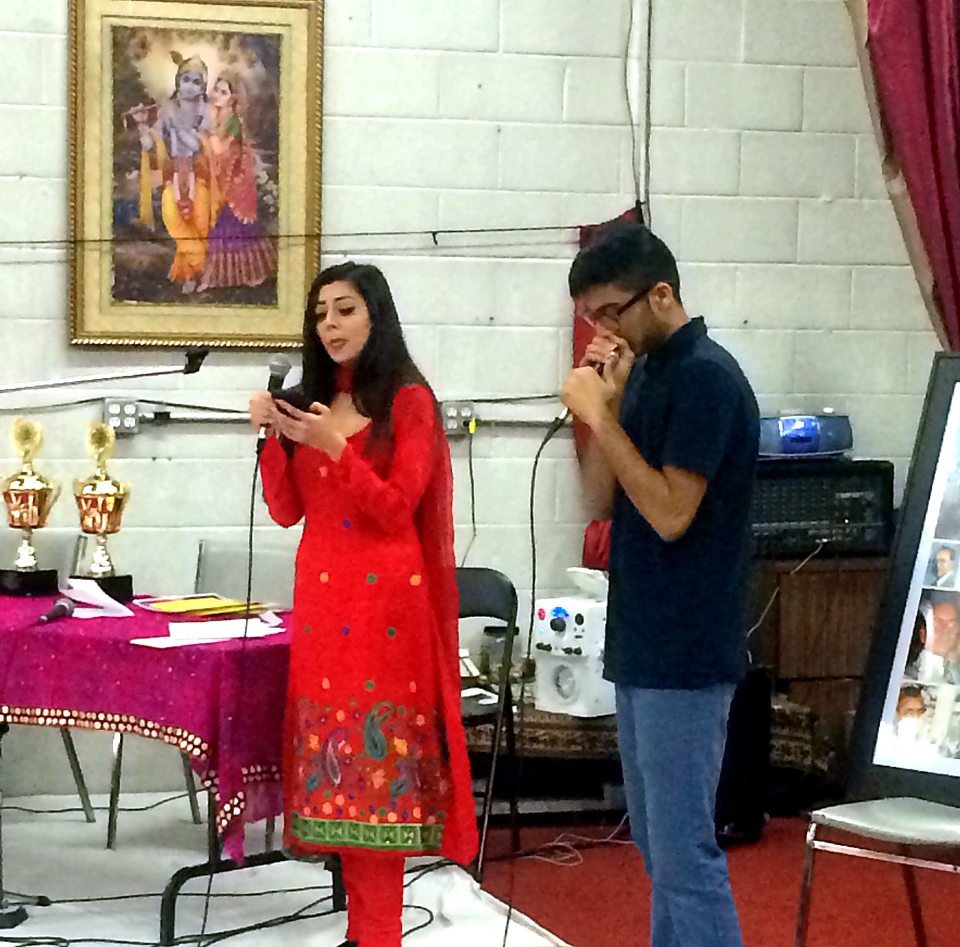 A singer and accompanist performing for the gathering