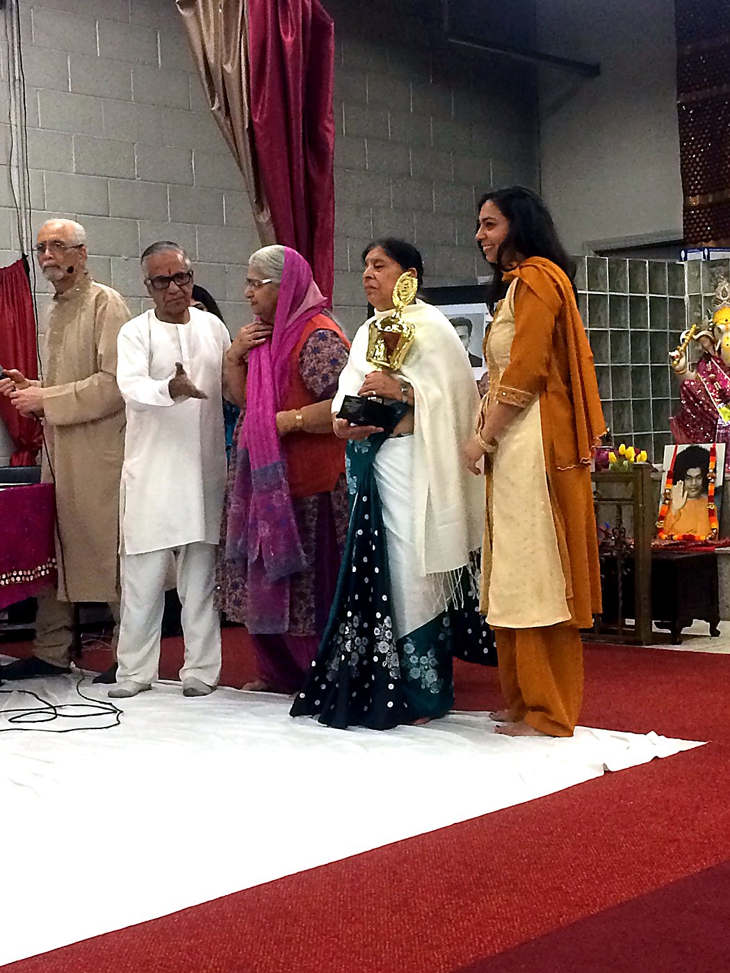 The M D Sharma Award trophy presented to its recipient, with her family beside her